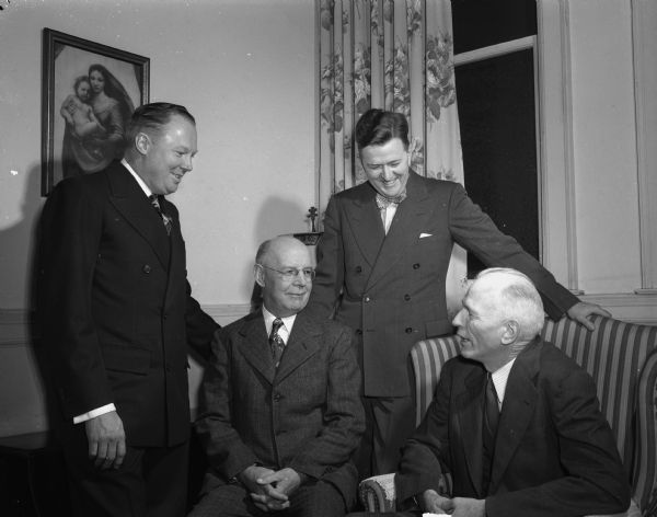 Two former pastors and two present pastors of First Baptist Church, 201 North Carroll Street, on the occasion of the congregation's 100th anniversary. Shown from the left are Revs.: L.B. Moseley, Pittsburg; A.T. Wallace, Madison, both former pastors; Charles R. Bell Jr., present pastor; and George L. 'Shorty' Collins, student pastor.