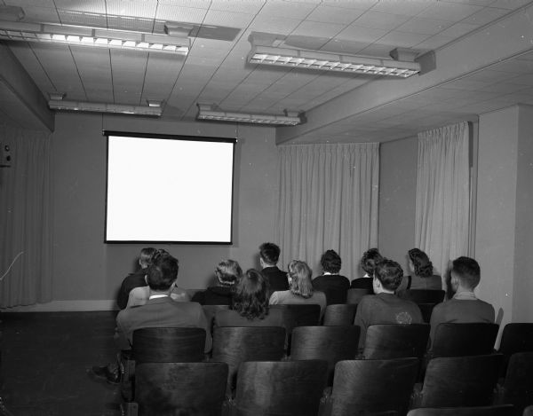 University of Wisconsin-Madison students watching a "teaching movie" at the Bureau of Audio Visual Instruction preview theater, 1312 West Johnson Street.