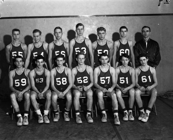 Group portrait of Wisconsin High School boys basketball team in uniforms with Coach Hal Metsen.