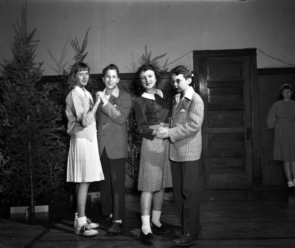 Among the young dancers who attended the traditional Christmas party for the boys and girls of Nakoma in the gym at Nakoma School were, left to right: Nancy Beggs, Ned Consigny, Mary Ellen Brehm, and Jerry Keilher.