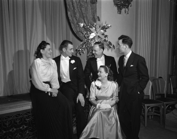 From the left: Mrs. Harry P. (Mary) Stoll, Harry P. Stoll, Robert Wegner, Mrs. Robert Wegner (seated), and Tom McKay at the Hotel Loraine attending the Junior Chamber of Commerce and "Jaycettes" cabaret-style dinner.