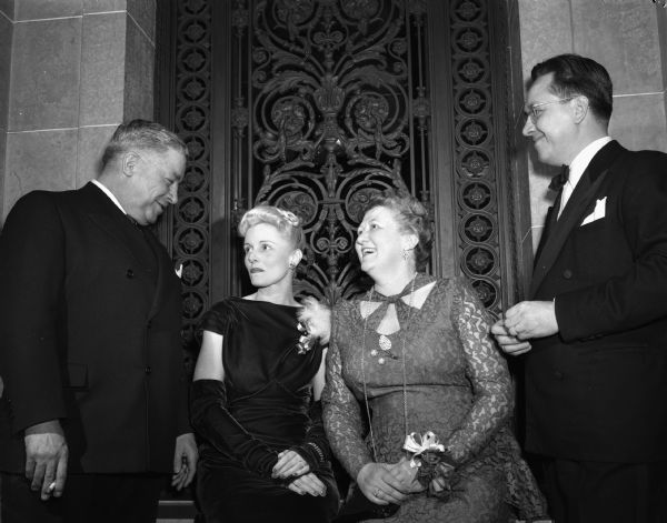 Pictured are, left to right: Attorney General John E. Martin, Mrs. Stewart (Lillian) Honeck, Mrs. John E. (Mary) Martin, and Deputy Attorney General Stewart Honeck.  The couples were attending the Centennial Ball at the Wisconsin State Capitol.