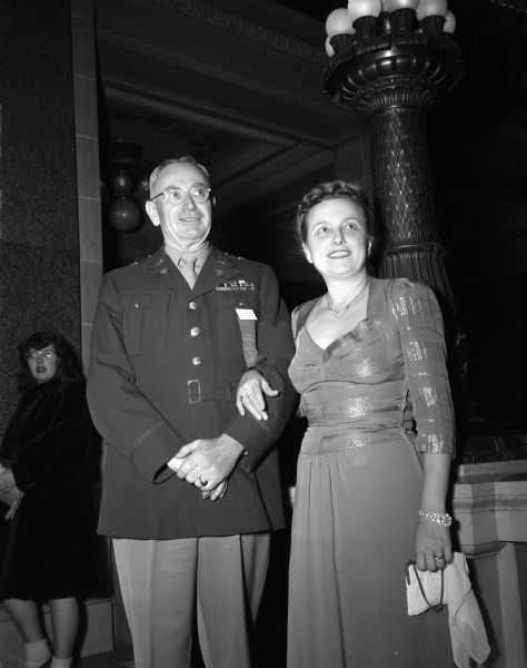 Portrait of Adjt. General and Mrs. John F. Muller from West Point Military Academy.  The couple is attending the Wisconsin Centennial Ball at the Wisconsin State Capitol.