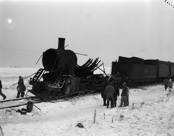 The remains of the Milwaukee Road railroad engine of the Portage to Madison passenger train, which exploded and derailed south of Arlington in Columbia County. The fireman was killed instantly and the engineer seriously injured.
