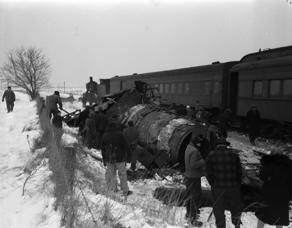 The remains of the boiler tank of the Milwaukee Road railroad engine of the Portage to Madison passenger train, which exploded and derailed south of Arlington in Columbia County. The fireman was killed instantly and the engineer seriously injured. 

 
