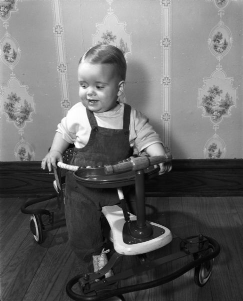 Infant, Ellen De Muth, shown in a baby walker.