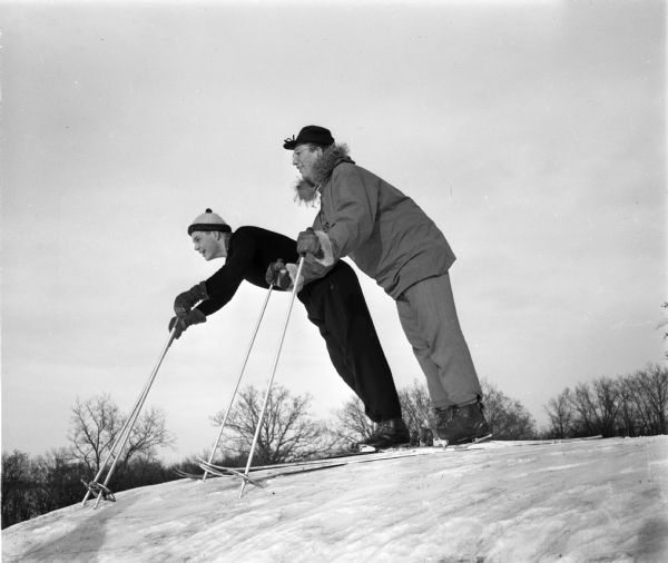Two teenage skiers poised at the top of the hill at Blackhawk Ski Run. Hartman Axley is on the left and Bob Herman on the right.