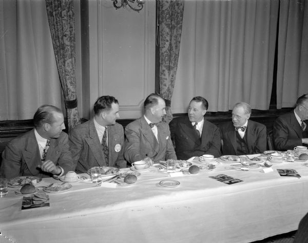 Shown from left to right at the Junior Chamber of Commerce Bosses Night banquet are: Lloyd Kohl, JCC president; William C. Sachtjen, Madison Council president; John J. Walsh, University of Wisconsin boxing coach; Leonard E. Read, main speaker and president of the Foundation for Economic Education, New York City; and Norman Bassett, president of Demco Library Supplies.