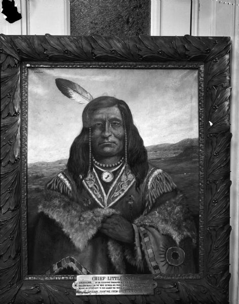 Portrait painting of Chief Little Shell, Chippewa Native American. The painting is leaning against a wall. Part of the T.B. Walker Indian Collection, on loan to the Wisconsin State Historical Society.