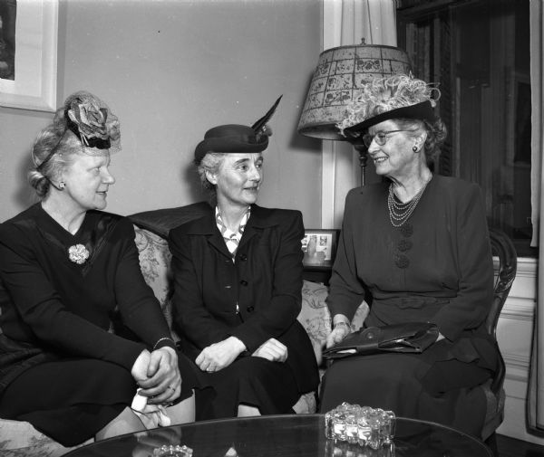Shown at the American Association of University Women tea from the left: Mrs. Ralph A. (Jessie) McCanse; Mrs. Hans H. (Theresa) Reese; and Miss Ruth Campbell.