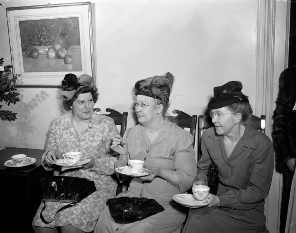 From left to right: Mrs. Charles Dernbach, Almond; Mrs. Walter Kuhrt, Almond; and Mrs. W.M. Erdenberger, Prairie du Chien, at a tea at the executive residence as part of the University of Wisconsin Farm and Home Week activities.