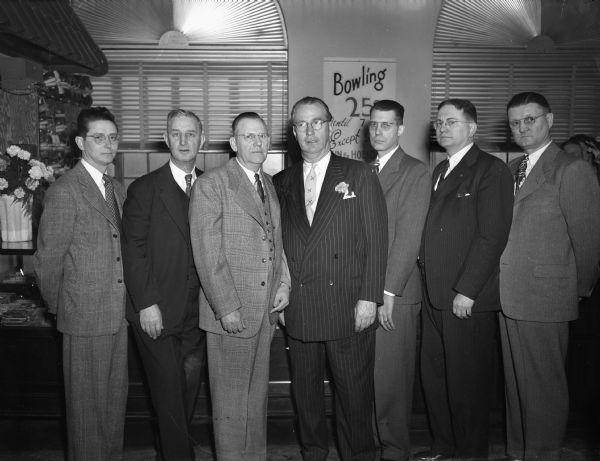 Men's Bowling tournament officials: left to right, Lee Edwards, William N. Blu, Ray Farness, "Roundy" Coughlin, John Dillon, Bob Aspinwall, and Earl Haase.