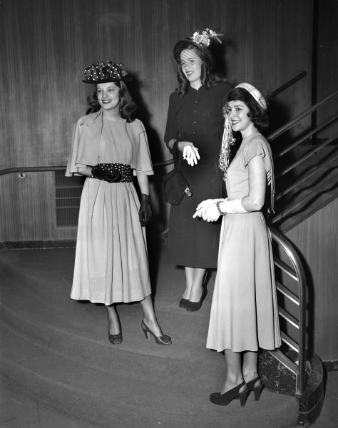 University of Wisconsin co-eds modeling spring fashions at the Women's Self Government Style Show at the University of Wisconsin Union Theater. Left to right: Virginia Rowlands, Arlington, VA; Jean Bieler, Western Springs, IL; Barbara Jean Hurst, Normal, IL.