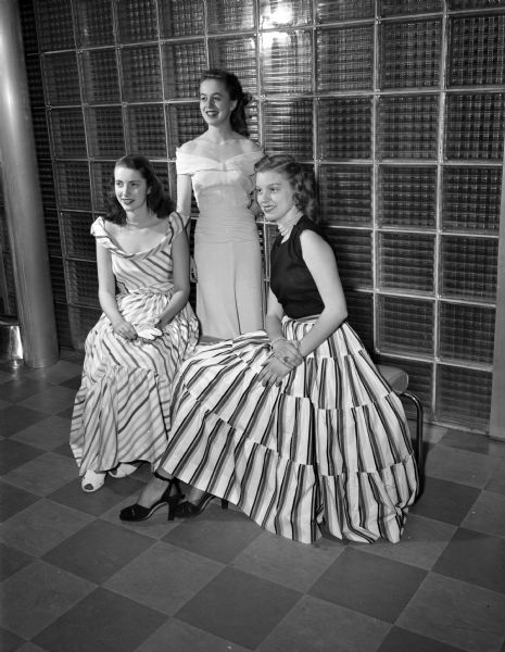 University of Wisconsin co-eds modeling spring fashions at the Women's Self Government Style Show at the University of Wisconsin Union Theater. Seated left to right: Nancy Marshall, Madison and Jean Kerth, St. Louis, MO. Standing is Catherine Craig, Janesville.