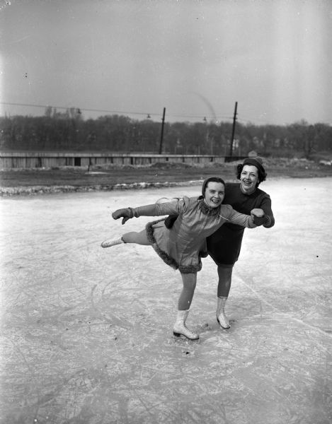 Two members of the Madison Figure Skating Club at Vilas Park. Pictured are Mrs. H.A. (Winifred) Balsley, vice-president (left), and Mrs. Alan (Jessie) Nelson, publicity committee chairman.