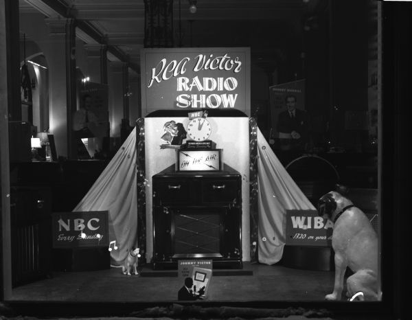 Window display featuring RCA Victor radios and station WIBA advertising the new FM broadcasting service.