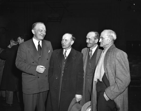 Harold E. Stassen (left), greets three men after his campaign speech in Fort Atkinson. Left to right are Clarence and William Trieloff, and Roy Marshall, president of the Jefferson County Farm Bureau.