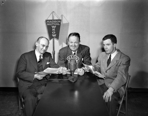 Three men seated at a microphone, at WKOW radio, representing the Wisconsin Council of Churches.