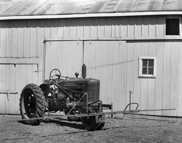 Farmall Tractor outside the Kupfer Foundry and Iron Works, 101 Waubesa Street. Photograph taken for R.L. Kulzick advertising agency.