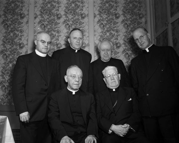 Newly-appointed deans of the Madison Catholic Diocese. Left to right, front row: the Rt. Rev. Msgr. Joseph Delaney, Janesville; and Bishop William P. O'Connor.  Rear row, left to right: the Revs. Michael Jacobs, Jefferson; F.A. Gray, Baraboo; John Piette, Portage and the Rt. Rev. Msgr. Bernard Doyle, Darlington.