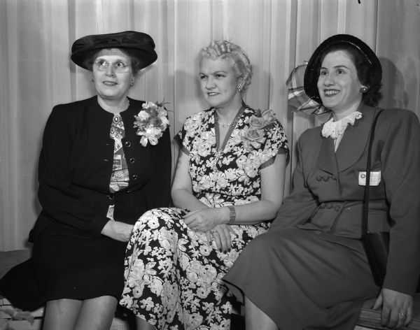 Shown at a tea held at the Governor's Residence, 130 E. Gorham Street, for more than 500 Wisconsin PTA unit and council presidents are Mrs. James C. Parker, Grand Rapids, Michigan; Mrs. Oscar Rennebohm, wife of the governor; Mrs. Harvey Horwitz, Milwaukee.
Mrs. Parker is vice-president of region four of the National Congress of Parents and Teachers and was the principal luncheon speaker.