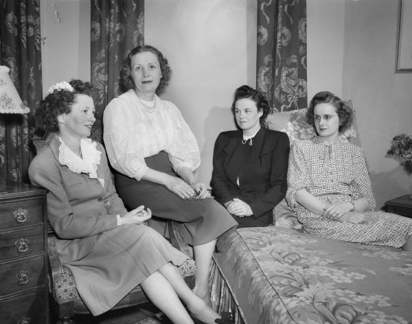 Four officers of the Notre Dame Woman's Club of South Central Wisconsin: (left to right) Mrs. Thomas (Marie) Frost, president; Mrs. Robert P. Reagan, secretary; Mrs. William Gorgen, treasurer; and Mrs. William (Pauline) Brennan, vice-president.
