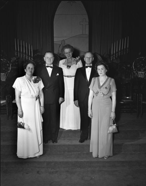Group portrait of officers of the grand chapter of the Order of Eastern Star and the Monona chapter no. 5. Left to right: Mrs. Nita K. Howard, worthy matron, and  LeRoy Cholseth, worthy patron, Monona chapter; Mrs. Jenne Lyngaas, Oskhosh, worthy grand matron, Jack Markham, Two Rivers, grand sentinel, and Mrs. Edna Heller, Janesville, grand martha, the grand chapter of Wisconsin.