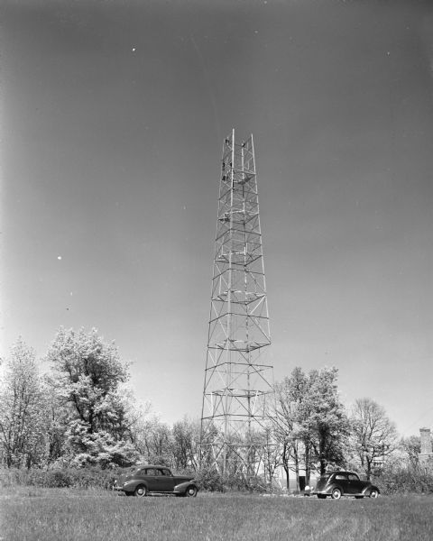WIBA-FM, 45,000 watts, tower was built at Blue Mounds Park, and radiated power starting about June 10, 1948. WIBA was established in 1925 by <i>The Capital Times</i> and was affiliated with the National Broadcasting Company on July 18, 1931. Men are working near the top of the tower.