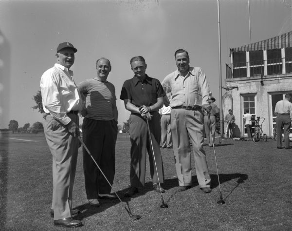 Four athletic directors who participated in the Western Conference "Big 9" Officials Golf Tournament at the Maple Bluff Country Club. Left to right: Frank McCormick, Minnesota; Harry Stuhldreher, Wisconsin; James Hagan, Pittsburg; and Ted Payseur, Northwestern.