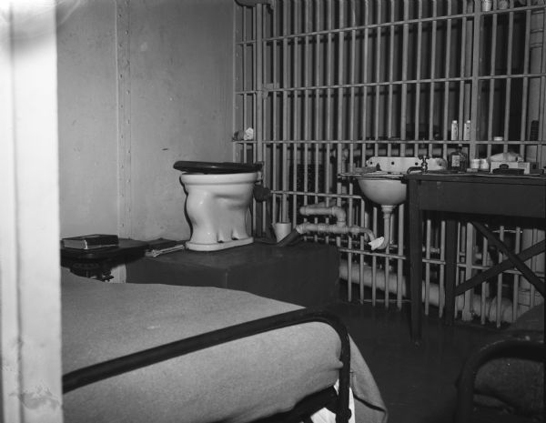Interior view of women's cell in Dane County jail, showing unfit conditions.