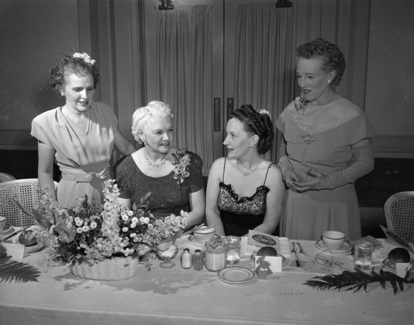 Taking part in the East Side Women's Club spring banquet are, left to right: Mrs. John (Myrtle) Nordby, 410 N. Baldwin Street, toastmistress; Mrs. Oscar (Mary) Rennebohm, guest of honor; Mrs. John T. (Emily) Sprague, 32 Paget Road, general chairman; and Mrs. Norman Wang, 1225 Rutledge Street, president.