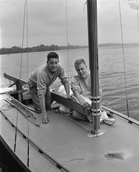 Gene Wheeler, right, on his class C sailboat <i>High Sea II</i>, with his crew member David Frederickson.