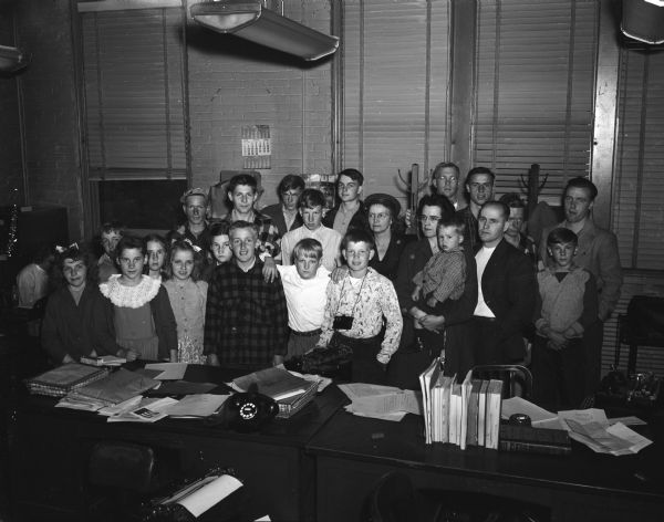 Group portrait of student members of grades five through eight of Lake Nebagamon village school, Douglas County. The students are pictured as they visited the <i>Wisconsin State Journal</i> as part of a 3-day trip to Madison and other parts of Wisconsin.