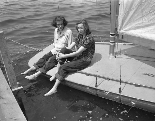 Two of Madison's most enthusiastic young sailors are Ann Hastings, left, daughter of Mr. and Mrs. Harold W. Hastings, 3326 Lake Mendota Drive, and Rosamond Ross, daughter of Mr. and Mrs. Frank A. Ross, 3547 Topping Road.