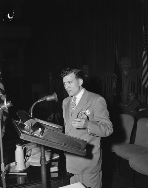Representative Glenn Davis, chairman of the Republican State Convention, shown at the podium addressing the delegates.
