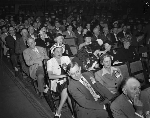 A general view of the Dane County delegation at the Republican State Convention, with Reuben W. Peterson, Madison attorney and one-time Public Service Commissioner and legislator in the front row. Seated directly behind him is delegate Mrs. Clifford Mathys.
