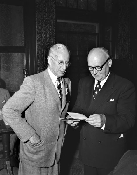 Max Mason, left, UW Class of 1898, Chairman of the council of Palomar Observatory in California, shown being welcomed by UW President E.B. Fred at the University of Wisconsin Half Century Club annual meeting.