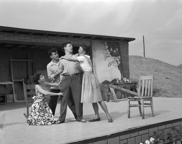Professor Ronald E. Mitchell's Crater Players. Left to right are: Muriel Berkson, Edwin Morgan, Clifford Owen and Josephine Bomgardner rehearsing on stage.