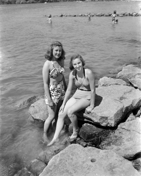Group portrait of Louanne Roberts, at left, and Marilyn Jones, at right, pictured at the Willows Beach which officially opened for the summer. Both girls placed in the 1947 city swimming meet.