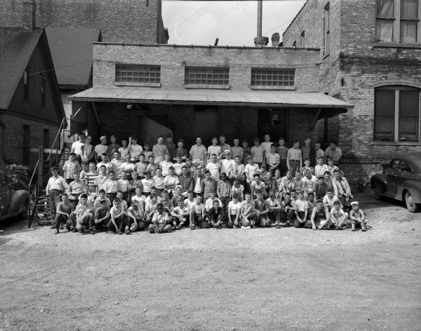Group portrait of 110 <i>Wisconsin State Journal</i> paper carriers taken prior to leaving for Blue Mounds State Park for the annual all-day outing.