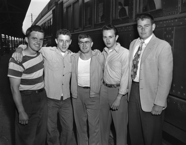 Five Madison recent high school graduates prior to traveling to Chicago for entrance into the U.S. Navy under the high school training program. From left are Richard Palmer, West; Jimmie Lottes, East; Mike Gentilli, Edgewood; Richard Clifford, Central; and Bill Sarles, Wisconsin High.