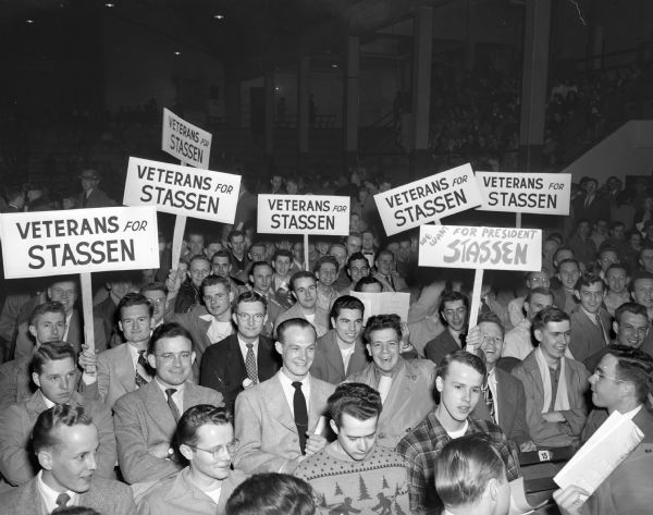 A group of veterans, members of the Wisconsin Veteran's-for-Stassen Club, seated in the reserved section at the Harold Stassen rally which was held at the University of Wisconsin-Madison-Stock Pavilion.