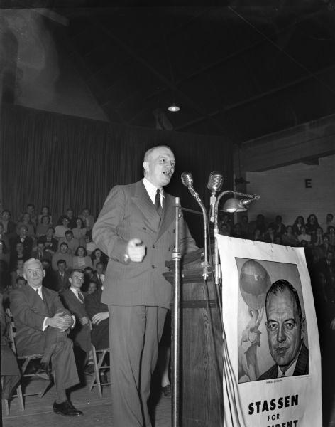 Republican candidate for president, Harold E. Stassen, addressing a crowd of 3,800 persons at the University of Wisconsin-Madison Stock Pavilion during a Stassen rally.