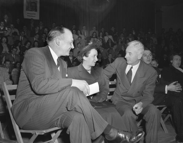 Republican presidential candidate Harold E. Stassen, left, and his wife, chatting with Tom Coleman, state Republican leader, during the Stassens' visit to Madison.