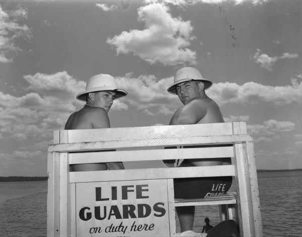 Art Ensign (left) and Chuck Steele seated in the lifeguard tower at Madison's Lakefront Beach. The City of Madison has placed experienced lifeguards at 8 beaches in the city to promote water safety and administer first aid.