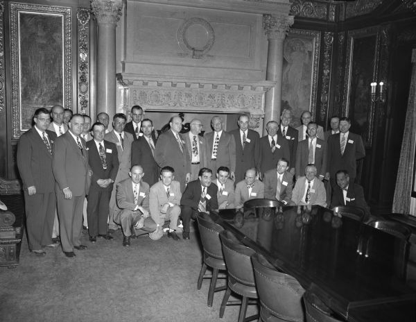 Large group of men in Wisconsin Governor's conference room at the Wisconsin State Capitol. (Possibly group of National Guardian Life insurance agents from Iowa.)