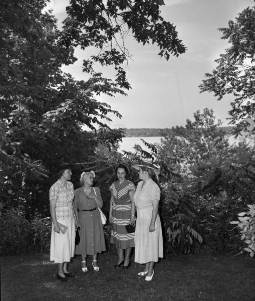 Women representing Presbyterian churches of Madison attended the garden party given at the home of Mrs. W.H. Conlin, 739 Farwell Drive, in honor of Mrs. Howard E. Anderson, missionary on furlough from India. Shown left to right are: Mrs. R.L. Blodgett, Mrs. Nobel Clark, Mrs. Randall Gay, and Mrs. J.C. Ryan, all members of Christ Presbyterian Church.