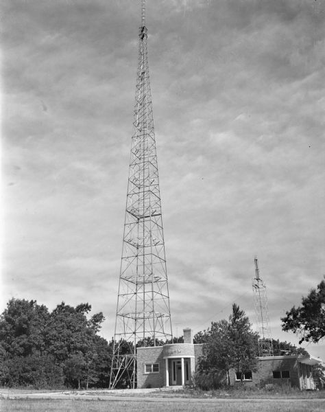 The higher antenna of the WIBA tower and transmitting station increased the power of the station for the newly operational FM transmission at the Blue Mounds site. The temporary tower was 50 feet high and the completed tower is 345 feet high.