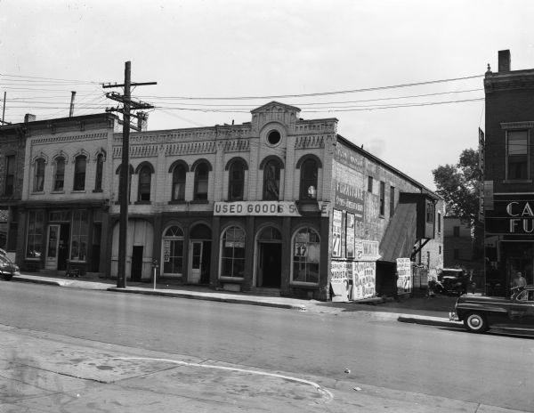 The condemned landmark building at 113 South Webster Street will be torn down starting July 20, 1948. The used furniture business of the Arneson Brothers will move to 109 South Webster Street. The building originally housed the H. Grove and Sons cigar factory.