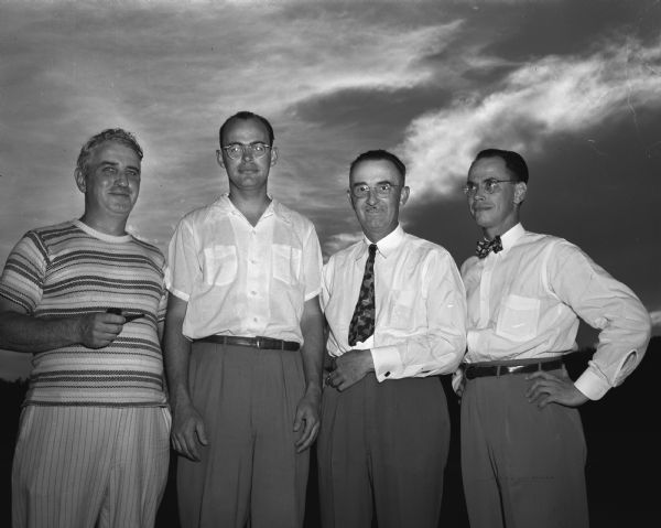 Top prize winners in the annual Wisconsin Medical Society golf tournament at Maple Bluff Country Club. Left to right: Dr. Paul Purtell, Milwaukee; Dr. Harry Maxwell, Milwaukee; Dr. George Love, Oconomowoc; and Dr. James Miller, 3220 Tallyho Drive, Madison.